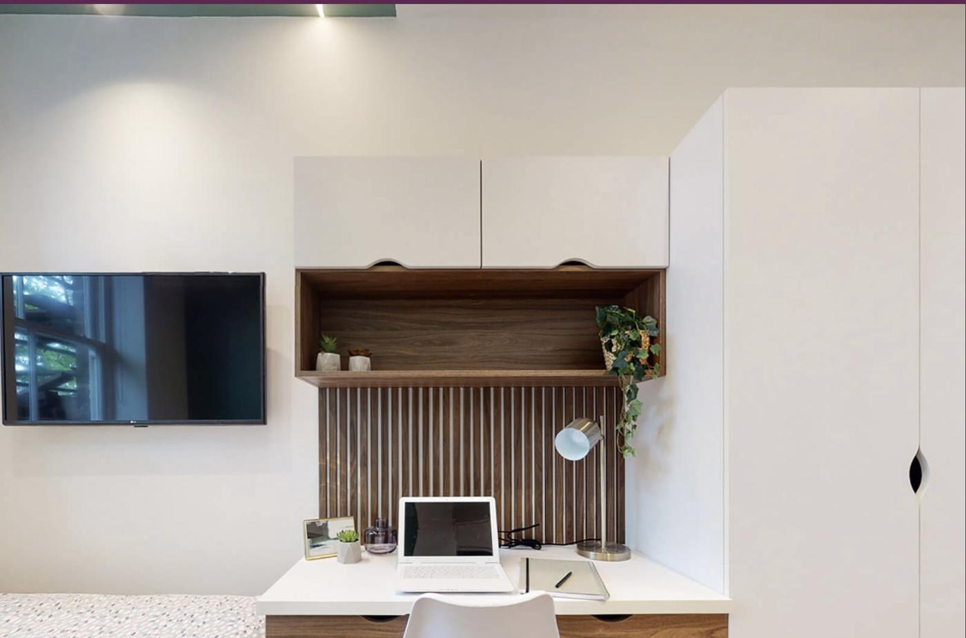 Castello Court study area with slatted walnut desk unit, wall cupboards and wardrobe