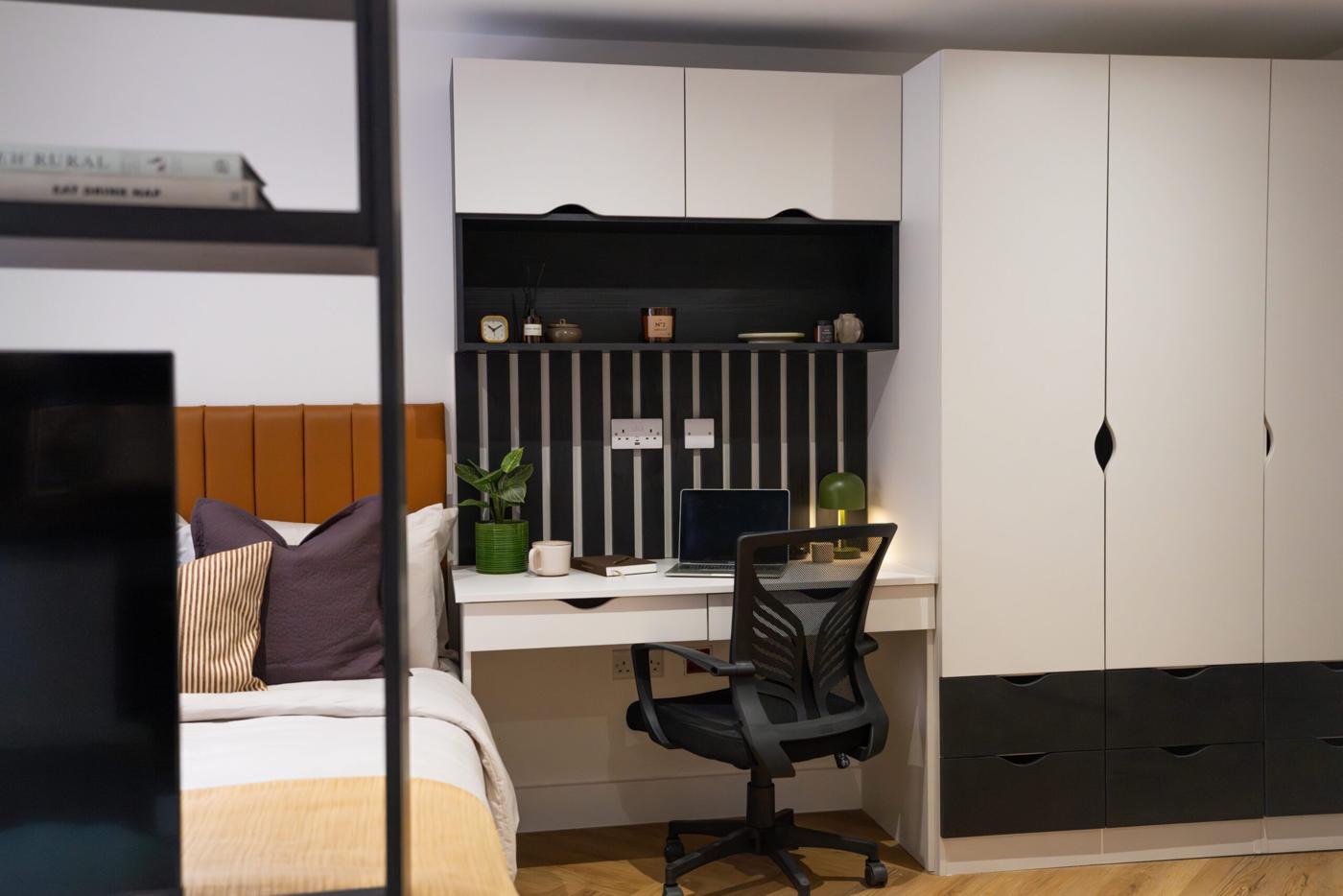 New Walk desk unit beside a white wardrobe with black drawers