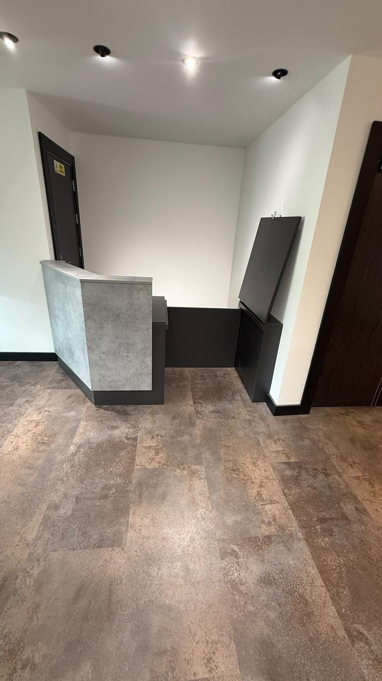 New Walk concrete-effect reception counter in the entrance lobby